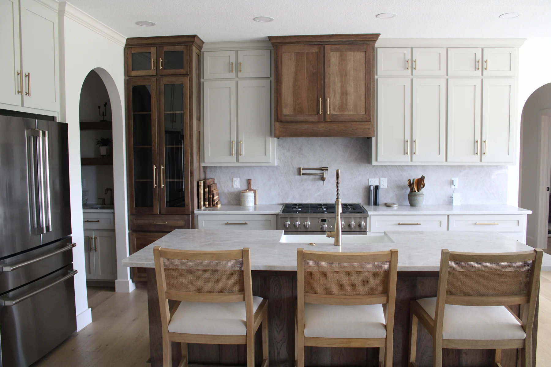 Shorehome Kentucky kitchen with white cabinetry and warm wood details