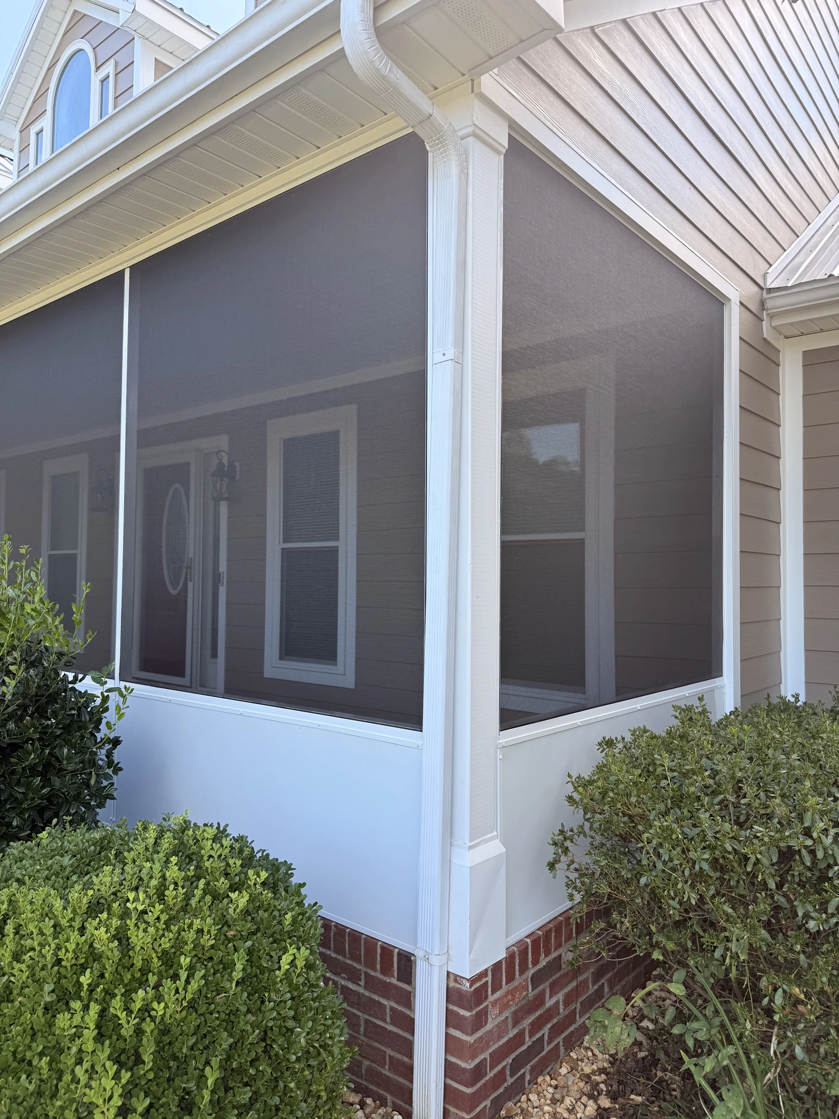 Completed Shorehome screen enclosure with finished white lower panels