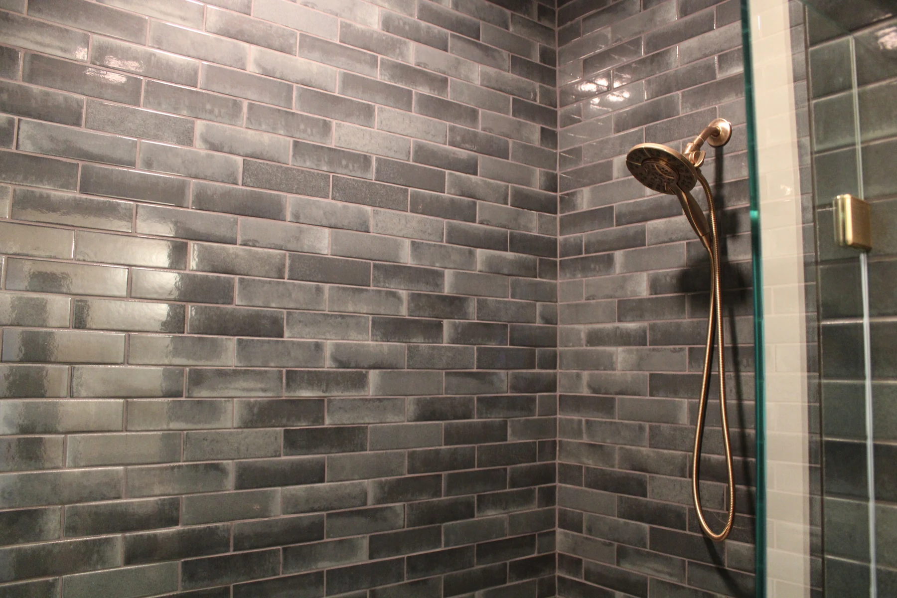 Clean tile lines and warm metal fixtures in a Kentucky project photographed by Shorehome.